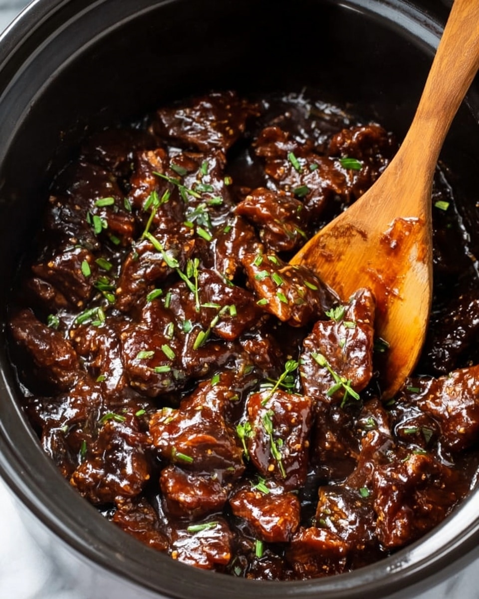 The image shows a dark pot filled with many pieces of meat covered in thick, shiny dark brown sauce. The meat pieces are mixed closely together, and the sauce looks sticky and rich. Small bright green chopped herbs are sprinkled evenly on top, adding a fresh color contrast. A wooden spoon is partially visible, resting in the pot and partly covered by the meat and sauce. The pot is placed on a white marbled surface. photo taken with an iphone --ar 4:5 --v 7