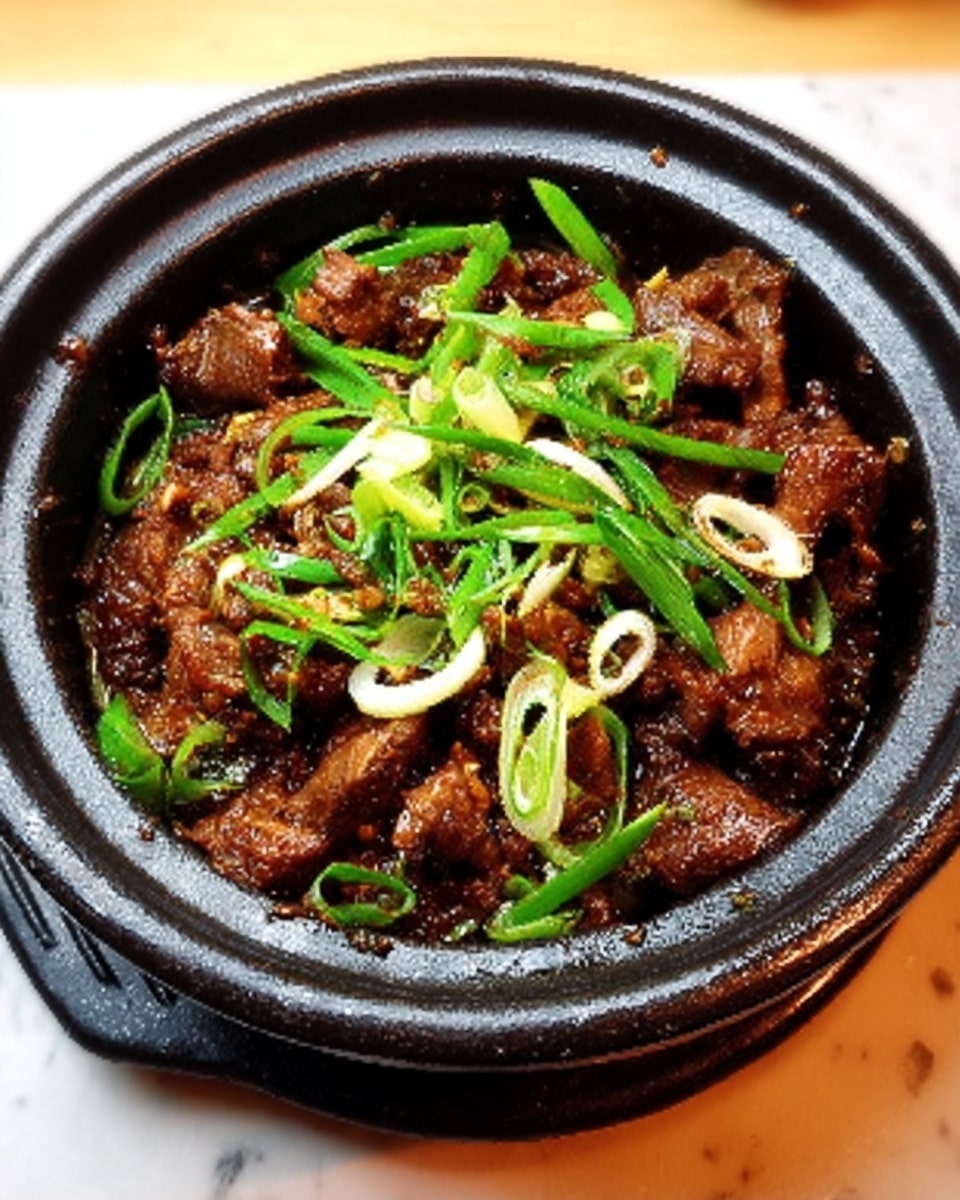 A round white bowl filled with cooked shredded meat, brown and slightly crispy on the edges. On top, thin strips of fresh green onions are scattered, adding a lively green color and slight texture contrast. The bowl sits on a white marbled surface, creating a clean background that highlights the rich browns and greens of the dish. The food looks warm and savory with small bits mixed in for extra texture photo taken with an iphone --ar 4:5 --v 7