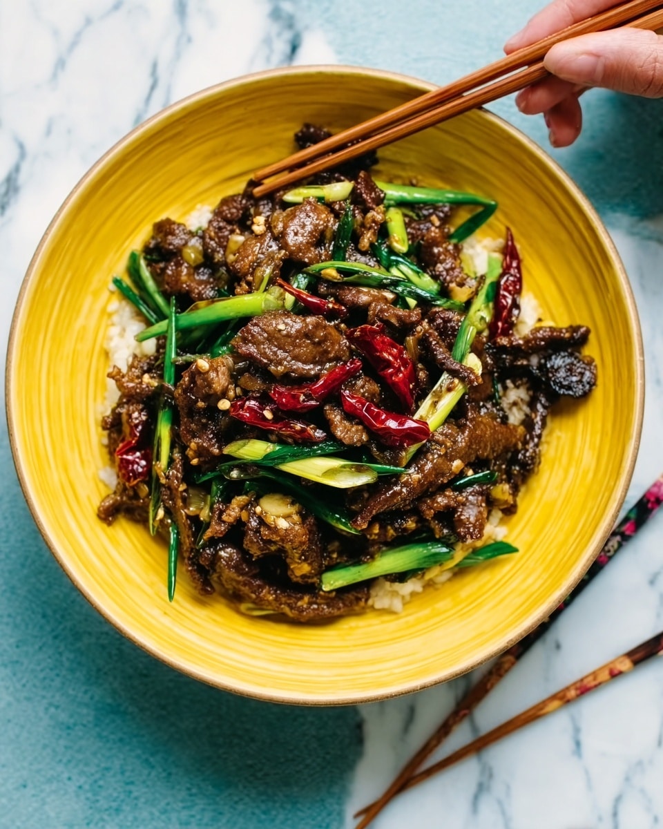 The image shows a yellow bowl filled with a dish made of small dark pieces of cooked meat mixed with bright green spring onion pieces and some dried red chili slices on top. The meat looks tender and slightly shiny, and the green onions add a fresh color contrast. The bowl sits on a white marbled surface, and wooden chopsticks rest on the side of the bowl. In the background, there is a woman's hand reaching for the bowl. Photo taken with an iphone --ar 4:5 --v 7