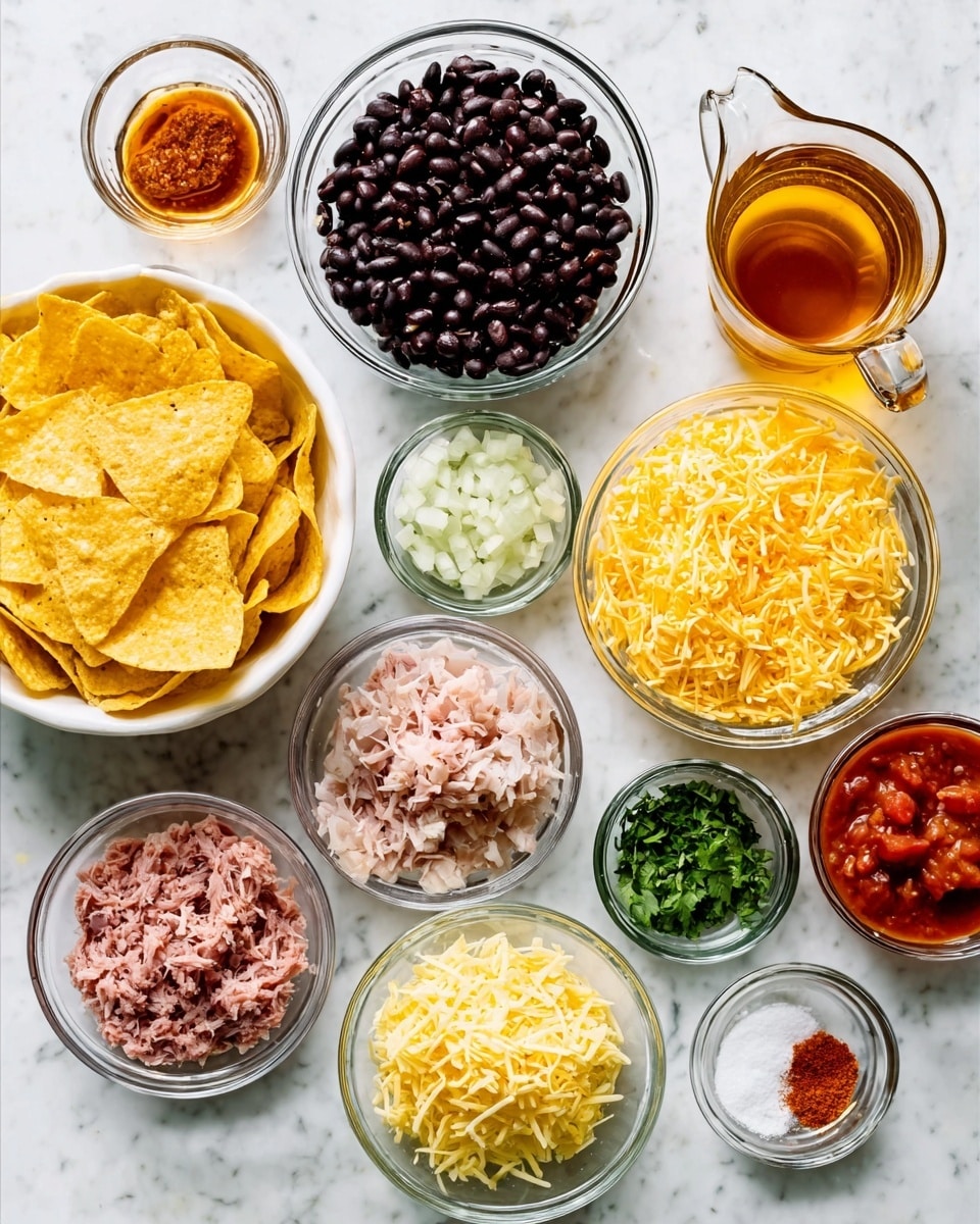 The image shows a white marble surface with several small clear glass bowls and a white bowl arranged neatly. The white bowl on the left contains yellow tortilla chips with a crispy texture. Next to it are clear bowls filled with different ingredients: black beans with a shiny, smooth texture; loose shredded yellow cheese with a light and soft appearance; small chopped white onions; finely chopped green herbs; a mixture of pale pink shredded meat; a bowl of red salsa with chunks and a glossy finish; and small amounts of red and white powders or sauces in mini clear bowls. A glass mug with an amber liquid is also present. The scene looks bright and clean. photo taken with an iphone --ar 4:5 --v 7