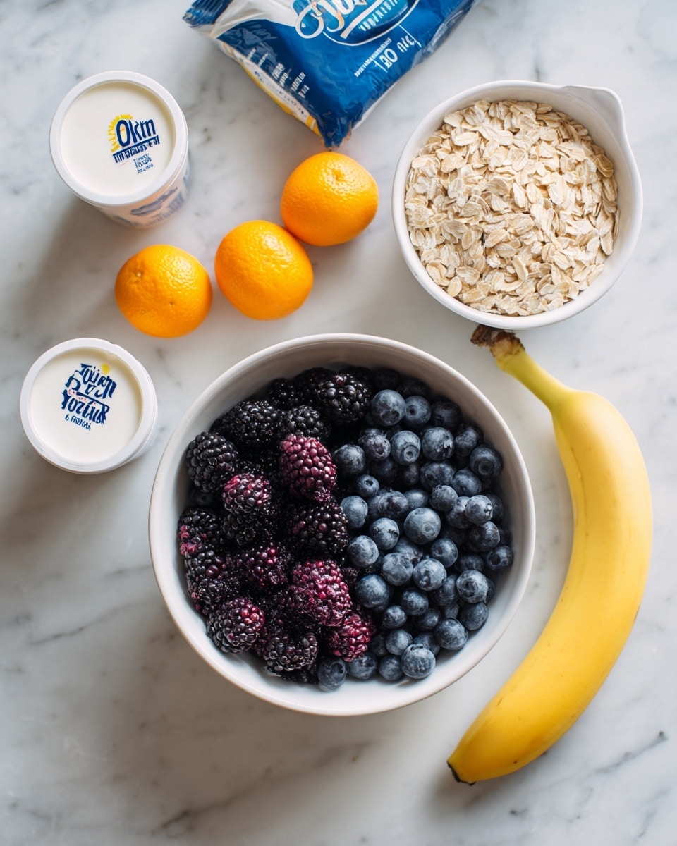 A white bowl filled with blackberries and blueberries sits on a white marbled surface. To the right of the bowl is a yellowish banana, slightly curved. Above the bowl is a white measuring cup filled with uncooked oats. Next to the oats are two small orange fruits, possibly kumquats. To the left of the bowl are two white containers of dairy products, one labeled as full-fat yogurt and the other as skyr. Above these items is a blue-and-white bag of oat cereal resting flat on the white marble background. Photo taken with an iphone --ar 4:5 --v 7