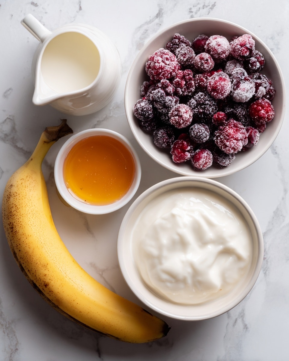 A white bowl filled with dark red and purple mixed berries, some covered lightly in frost, positioned near the top right. Below it, a white cup full of thick white yogurt shows a smooth texture. To the left of the yogurt cup, a white jug contains white milk. Above the milk jug, a small white bowl holds orange honey or syrup with a clear, shiny surface. A ripe yellow banana with some brown spots lies at the bottom center on a white marbled surface. photo taken with an iphone --ar 4:5 --v 7