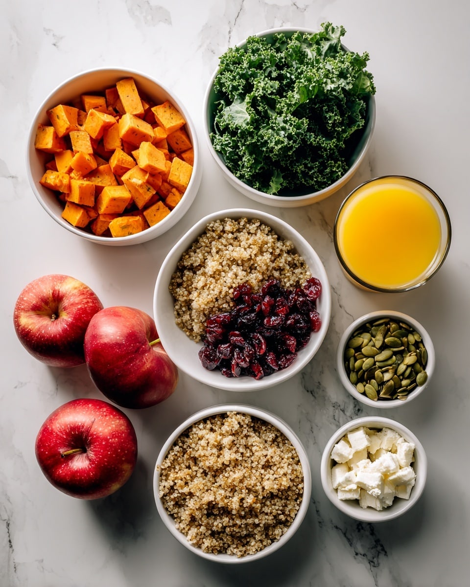 The image shows a white marbled surface with six white bowls and two red apples. One bowl contains small orange cubes of roasted sweet potatoes, another has fresh green kale leaves, and a third is filled with light brown cooked quinoa. There is a small bowl with dried dark red cranberries, another with light green pumpkin seeds, and a final small bowl with white crumbled cheese. Two whole red apples and a small glass of yellow-orange juice are placed on the sides. The scene is bright and colorful, showing fresh healthy ingredients, photo taken with an iphone --ar 4:5 --v 7