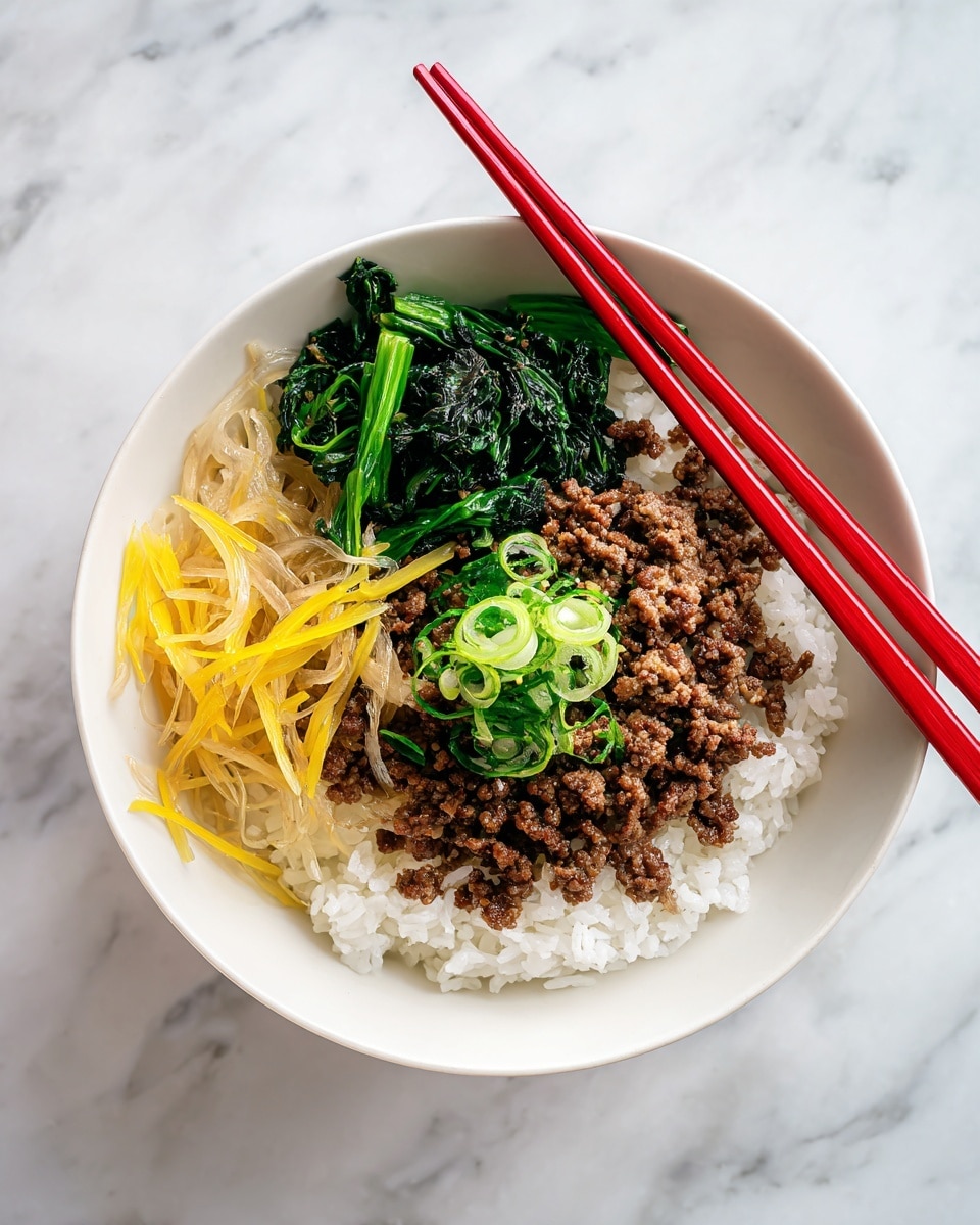 A white bowl holds a bed of fluffy white rice at the bottom layer, topped with a mix of brown cooked meat and translucent cooked onions. Thin yellow strips, possibly bamboo shoots, are scattered on top of the meat mixture. In the middle, there is a small pile of dark green leafy vegetables. Two red chopsticks rest on the edge of the bowl. The bowl sits on a white marbled surface. photo taken with an iphone --ar 4:5 --v 7
