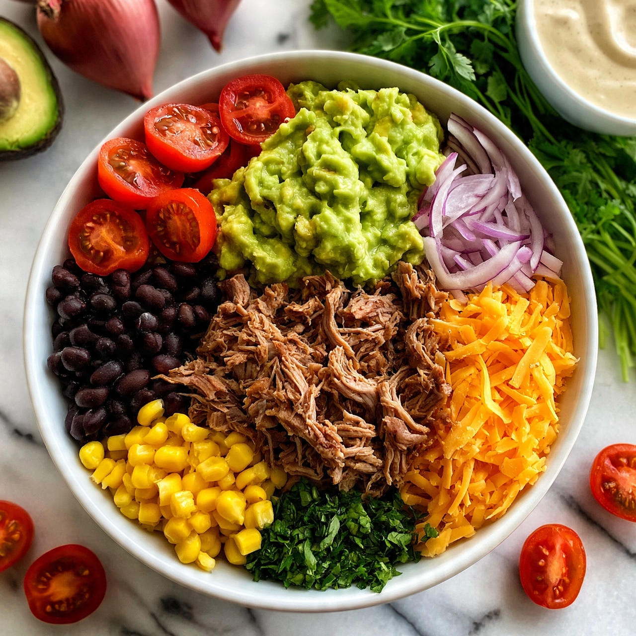 square image A white bowl on a white marbled surface filled with colorful, separated layers of food. Starting from the top left, there are halved cherry tomatoes in red, next to bright green mashed avocado in the center. To the right, thin slices of red onion in light purple form a small segment. Below the avocado is a pile of shredded cooked meat in brown, surrounded on the left by black beans and bright yellow corn, while on the right there is shredded orange cheese. Near the bottom center, finely chopped green herbs add color contrast. Surrounding the bowl on the white marbled surface are halved avocados, halved cherry tomatoes, whole red onions, a fresh bunch of cilantro, and a white bowl of creamy dressing. A woman's hand is not visible in the scene. Photo taken with an iphone --ar 4:5 --v 7