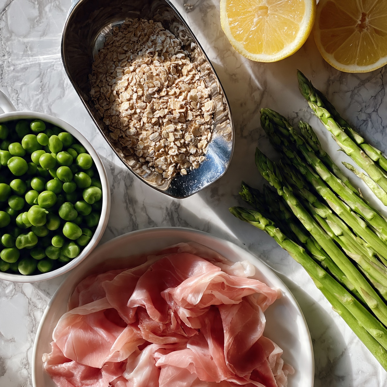 square image The image shows fresh green peas in a small white pot on the left, with a shiny metal scoop full of rolled oats placed above it to the center. To the right top corner, there are two lemon halves with bright yellow color. Below the scoop, there is a pile of raw thinly sliced pink prosciutto on a white plate. On the right side of the image, fresh green asparagus spears lie side by side. All ingredients are on a white marbled textured surface. photo taken with an iphone --ar 4:5 --v 7