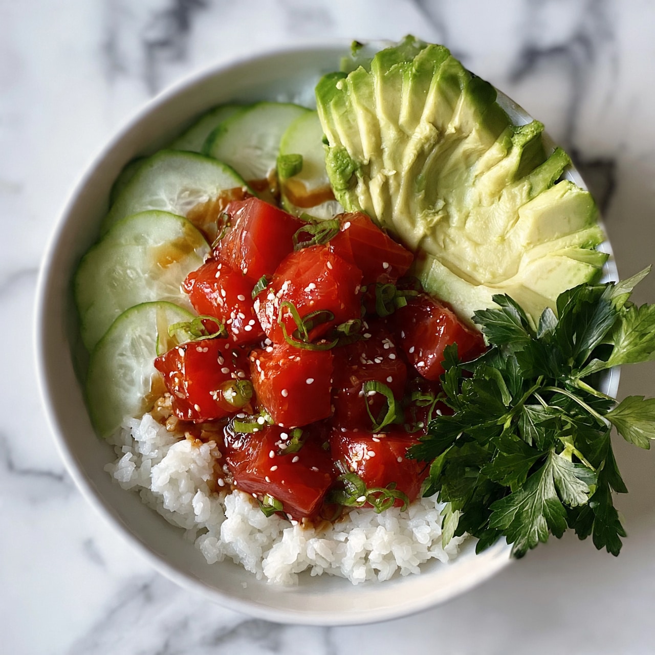 square image The dish is served in a white bowl placed on a white marbled surface. It contains a base layer of white rice covering the bottom of the bowl. On top, there are bright red cubes of fresh fish arranged in the center. Around the fish, there are thin slices of light green cucumber, fan-shaped slices of creamy green avocado on one side, and fresh parsley with dark green leaves on another side. The fish is drizzled with a light brown sauce and sprinkled with small white sesame seeds and thin slices of green onion. Photo taken with an iphone --ar 4:5 --v 7