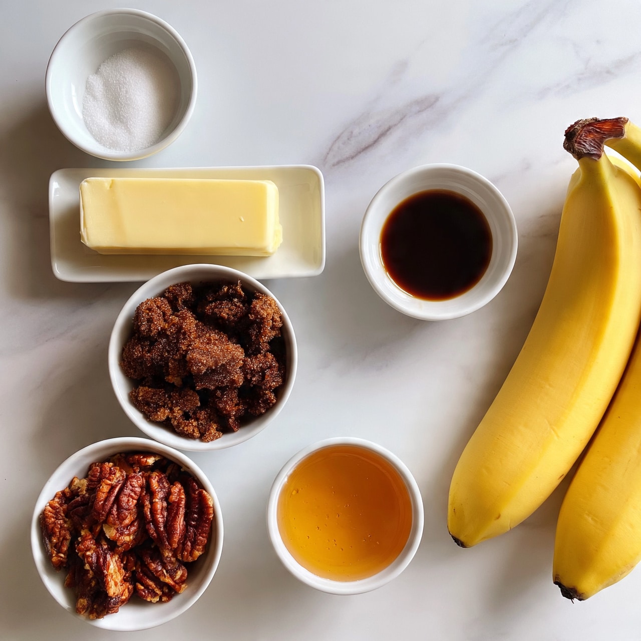 square image The image shows a white marbled surface with ingredients neatly placed in white round bowls and a white rectangular dish. There are two ripe yellow bananas on the right side. At the top left is a small white bowl with a white powder, likely salt. Below it is a white rectangular dish with a pale yellow stick of butter. Below that, a white round bowl filled with dark brown clumped brown sugar. Next to it on the right, a small white round bowl with dark amber liquid, likely vanilla extract. At the bottom left, a white round bowl filled with pecans that are reddish-brown and textured. On the bottom right, another small white round bowl contains golden honey or syrup. The items are carefully arranged without overlap, all on the white marbled surface. photo taken with an iphone --ar 4:5 --v 7