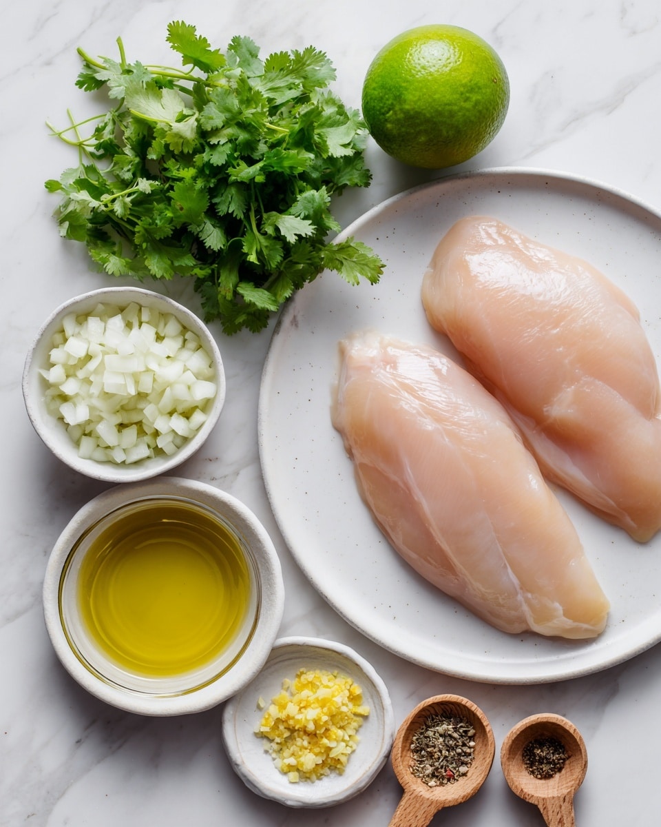 A white plate holds two raw chicken fillets with a smooth light pink surface, placed near the top right on a white marbled background. To the left, a small bunch of fresh green cilantro rests with vibrant leaves. Below the cilantro is a whole green lime with smooth skin. Nearby are small white bowls containing pale chopped onions with visible pieces, minced yellow garlic, and white salt. A small clear glass bowl holds golden-yellow olive oil. Two wooden measuring spoons with light brown seasoning and black pepper are placed near the bottom. The arrangement is clean and fresh. Photo taken with an iphone --ar 4:5 --v 7