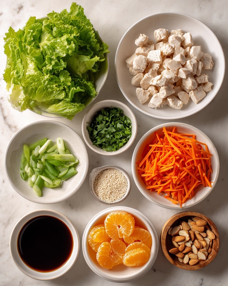 A top-down view of nine small bowls arranged neatly on a white marbled surface, each holding different bright and fresh ingredients. Starting from the top left, there is a small pile of crisp green lettuce leaves. Next to it on the right, a white bowl filled with small, evenly cut pale chunks of cooked chicken. Below the lettuce, a white bowl with finely chopped green herbs, while next to it is a small bowl with light beige sesame seeds. Below those, a small bowl with a dark brown liquid sauce, and to the left a bowl filled with sliced almonds. Near the center bottom, a white bowl holds shredded bright orange carrots, and to the right, an orange bowl is filled with shiny mandarin orange segments. Near the center, a small white bowl with chopped green onions completes the set. The image has a clean and fresh appearance, photo taken with an iphone --ar 4:5 --v 7