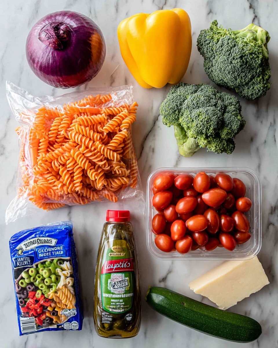 The image shows a collection of fresh ingredients arranged on a white marbled surface: a purple onion on the far left, a clear plastic bag filled with bright orange baby carrots above it, two small heads of broccoli with dark green florets and light green stems at the top center, a shiny yellow bell pepper just right of the broccoli, and a plastic container filled with small, bright red grape tomatoes on the far right. Below these vegetables, from left to right, there is a blue box of tri-color rotini pasta showing red, green, and yellow pasta spirals through a small window, a clear plastic bottle of Kraft Zesty Italian dressing with green and orange label details, a red can of Lindsay medium black olives, a cut piece of green zucchini with shiny skin and pale interior next to the pepper, and a wedge of pale yellow Parmesan cheese in paper wrapping on the bottom right. Everything is well-lit with even lighting, and the photo was taken with an iphone --ar 4:5 --v 7