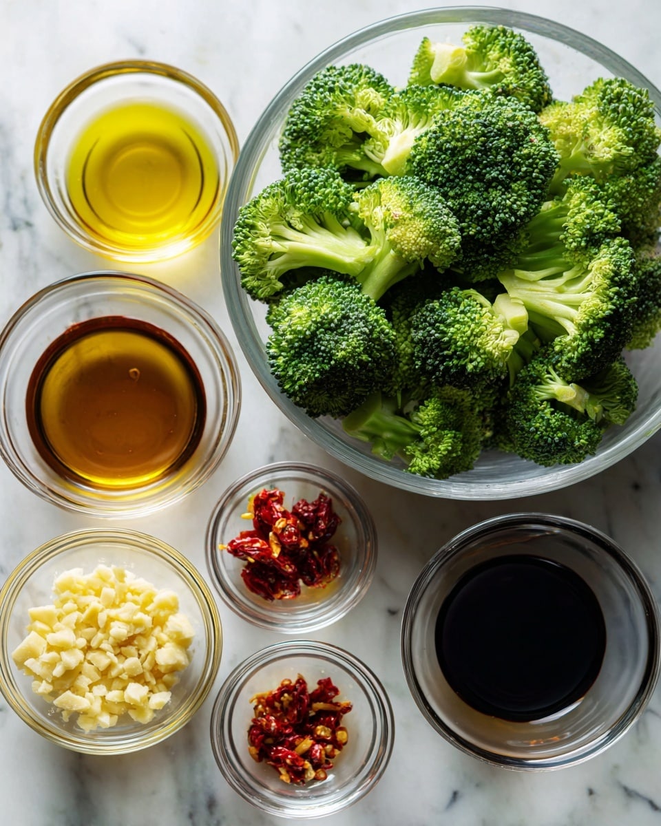 A clear glass bowl filled with bright green broccoli florets sits on a white marbled surface in the upper right of the image. To the left and below are six small clear glass bowls arranged in two rows. The top row holds golden yellow olive oil, dark brown soy sauce, amber-colored liquid, and red chili flakes. The bottom row includes crushed pale yellow garlic in the left bowl, and the two bowls to the right are empty. All bowls have smooth, shiny textures, and the scene is lit with soft natural light. photo taken with an iphone --ar 4:5 --v 7