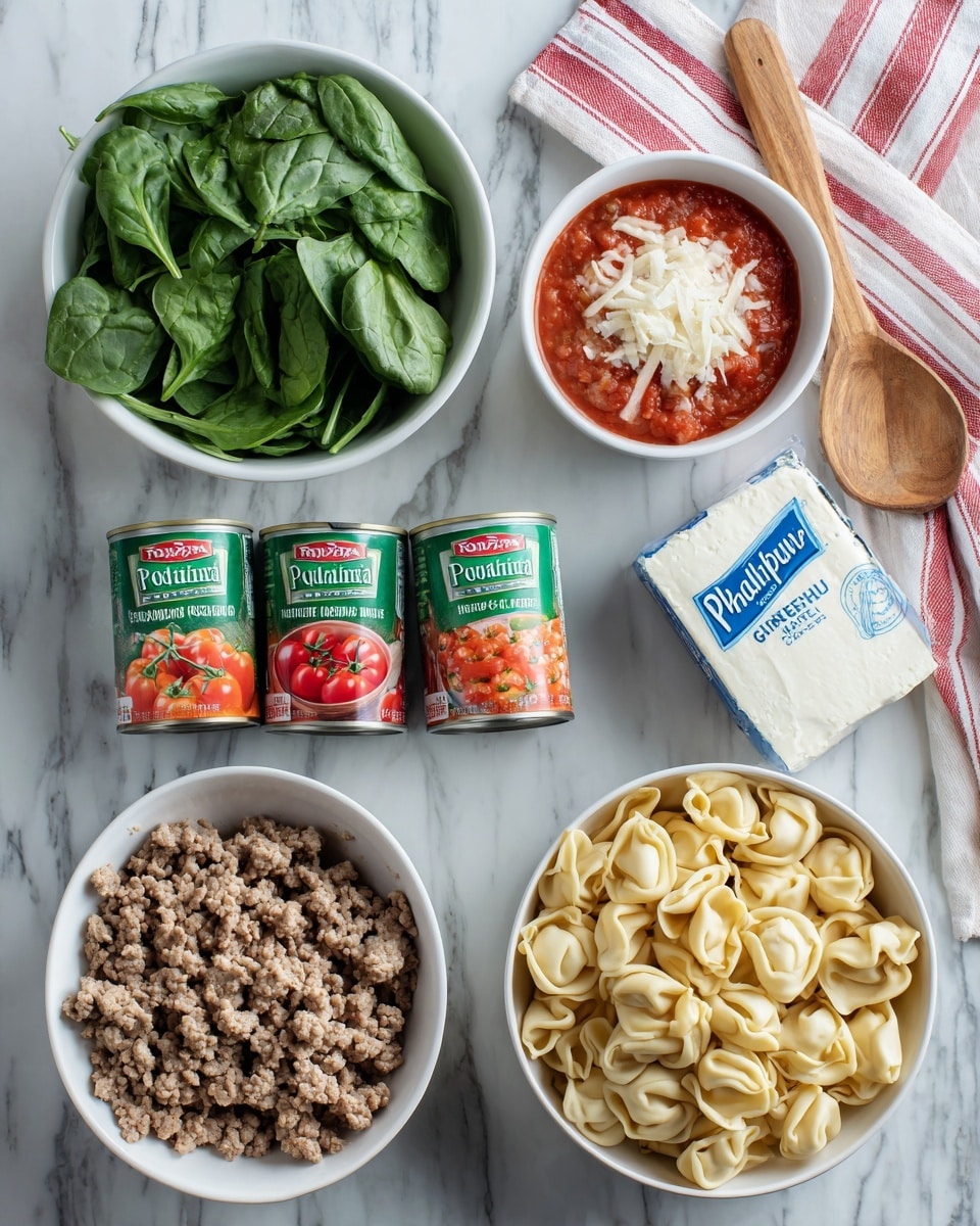The image shows several ingredients arranged neatly on a white marbled surface. There is a white bowl filled with fresh green spinach leaves on the left side. Next to it, two cans of Italian style diced tomatoes with green and red labels are placed side by side. Below the spinach bowl, there is a carton of vegetable broth with a green label. In the center, a white bowl holds cooked ground meat that looks finely crumbled and brown. On the right side, a white bowl filled with light beige tortellini pasta stands out. Above the tortellini bowl, a block of Philadelphia cream cheese in white and blue packaging is placed. A wooden spoon is partly visible in the top right corner on a cloth with red and white stripes. photo taken with an iphone --ar 4:5 --v 7