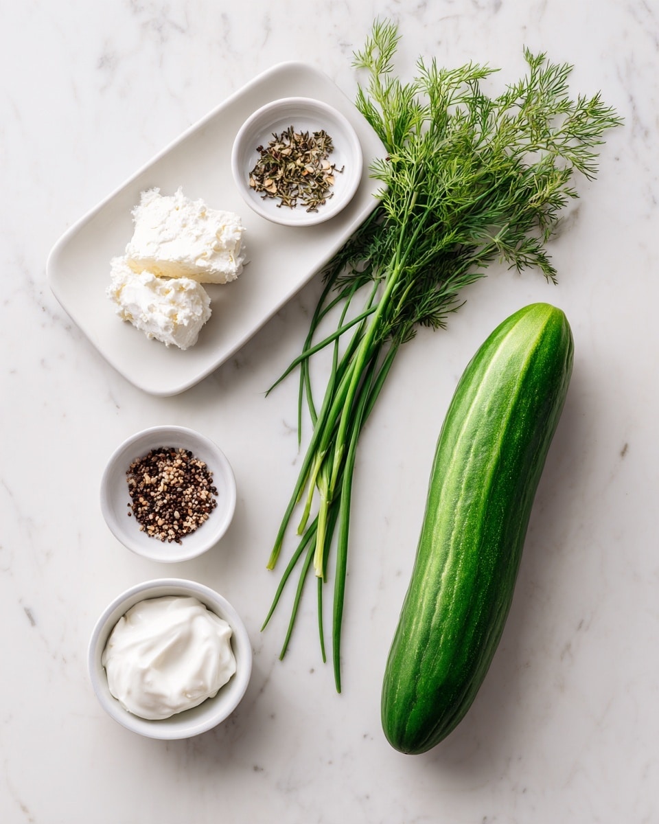 The image shows a long green cucumber placed horizontally on a white marbled surface. To the left, there are three small white bowls: one with a block of white cream cheese, one with a dollop of white sour cream, and one with a small mix of black and brown seeds or spices. Above these bowls, on a white rectangular plate, lie fresh green herbs including several chives with long slender stalks and feathery dill sprigs. The arrangement is neat and spaced out, with a clean, fresh look, photo taken with an iphone --ar 4:5 --v 7