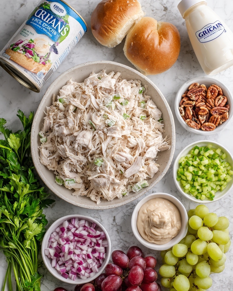 A large bowl filled with shredded white cooked chicken sits in the center on a white marbled surface. Surrounding it are several small white bowls holding chopped red onions, chopped celery, chopped pecans, a creamy mixture, a small amount of brown mustard, sweet relish, and cut red grapes with green grapes. To the left, there is a bundle of fresh green parsley and a white can of Grian’s crescent rolls with blue packaging. On the right side, a white bottle of kefir with a blue cap is visible. The whole setup is neatly arranged and colorful, showing fresh and creamy ingredients. photo taken with an iphone --ar 4:5 --v 7