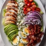 Cobb Salad with Grilled Chicken, Bacon, Avocado, and Blue Cheese drizzled in Red Wine Vinaigrette Recipe