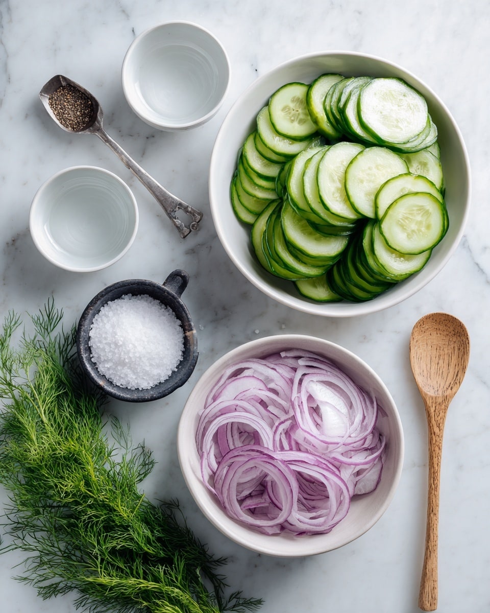 The image shows a collection of fresh ingredients arranged neatly on a white marbled surface. At the top right is a white bowl filled with bright green cucumber slices stacked in layers, showing their smooth, glossy texture. Below and slightly to the left is another white bowl containing thinly sliced purple onions with visible layers and a slightly translucent look. Two small white bowls with clear liquid are placed near the top left and bottom right corners. There is a small ceramic black bowl holding white granulated salt near the lower left center. Below this bowl is a wooden spoon filled with more white salt and a metal measuring spoon next to it filled with black pepper. At the bottom left, a bunch of fresh green dill is spread out with its delicate feathery leaves visible. photo taken with an iphone --ar 4:5 --v 7