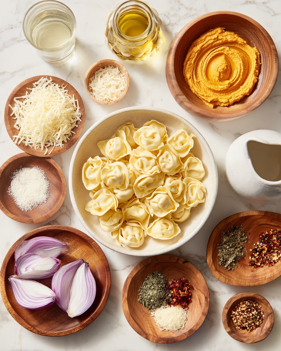 A white round bowl at the bottom center is filled with pale yellow tortellini pasta, each piece showing a distinct folded shape with smooth texture. To the left of it, a small white bowl holds shredded cheese with a light cream color. Above the tortellini, several wooden round plates and bowls are displayed on a white marbled surface. The top center wooden bowl contains a thick, smooth orange puree with swirled texture. A small wooden bowl in the middle contains fine white grated cheese. The bottom left wooden plate holds sliced light purple shallots with thin layers and chopped dried green herbs. To the right, a wooden plate shows an arrangement of finely chopped garlic, red chili flakes, salt, black pepper, and various brown spices, neatly spaced in small piles. On the right side, a white ceramic pitcher is filled with creamy liquid, next to a clear glass bottle with golden olive oil. A glass with light brown liquid and another small clear glass with water are placed on the left side near the top. The whole setting is neatly arranged on the white marbled surface. photo taken with an iphone --ar 4:5 --v 7